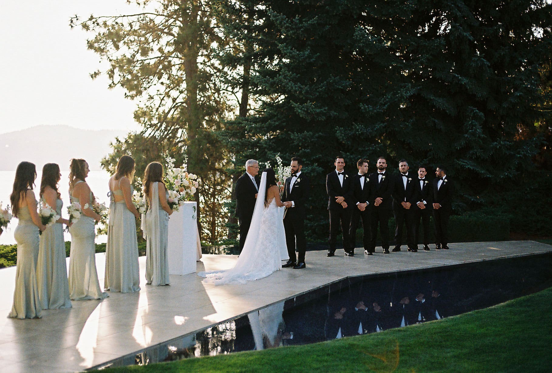 Ceremony on the lake candid moment by wedding photographer