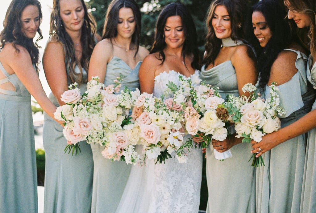 bride and bridesmaids candid moment by wedding photographer